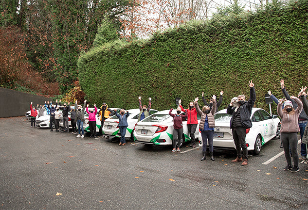 AspenClean team in Vancouver with AspenClean cars
