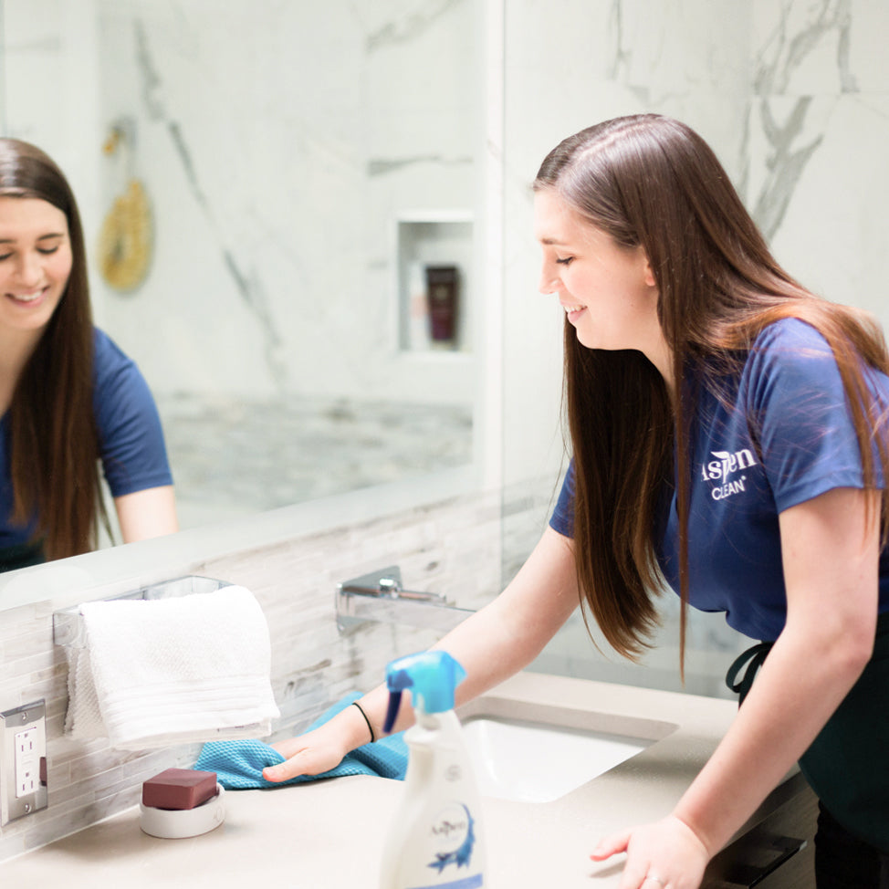 AspenClean Cleaning Team cleaning a bathroom with AspenClean Award Winning Bathroom Cleaner, Voted Best Green Cleaners by Parents Magazine in 2020, 2021, and 2022, 