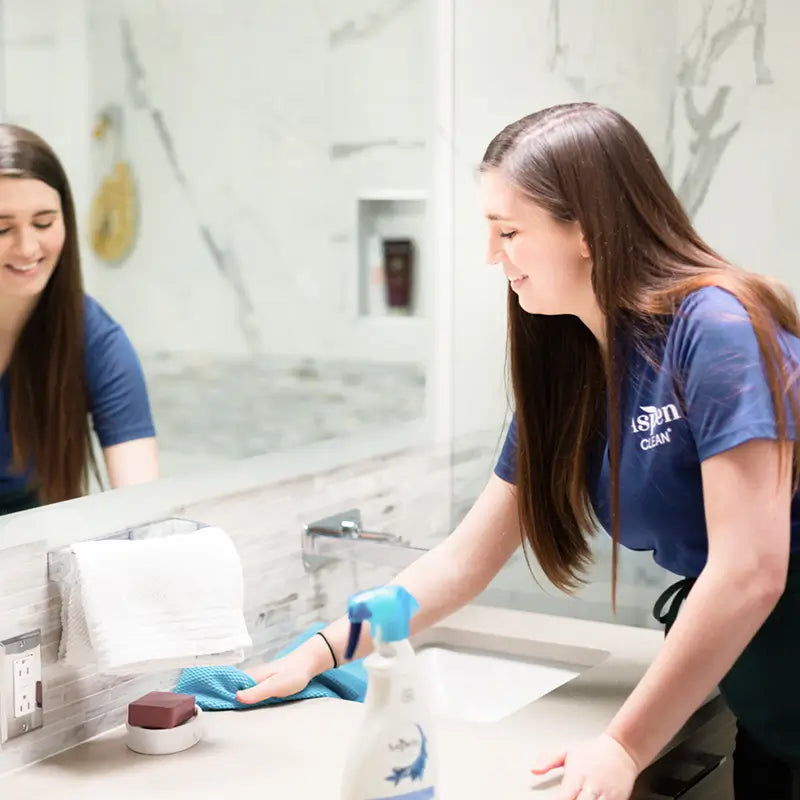 AspenClean Cleaning Team cleaning a bathroom with AspenClean Award Winning Bathroom Cleaner, Voted Best Green Cleaners by Parents Magazine in 2020, 2021, and 2022